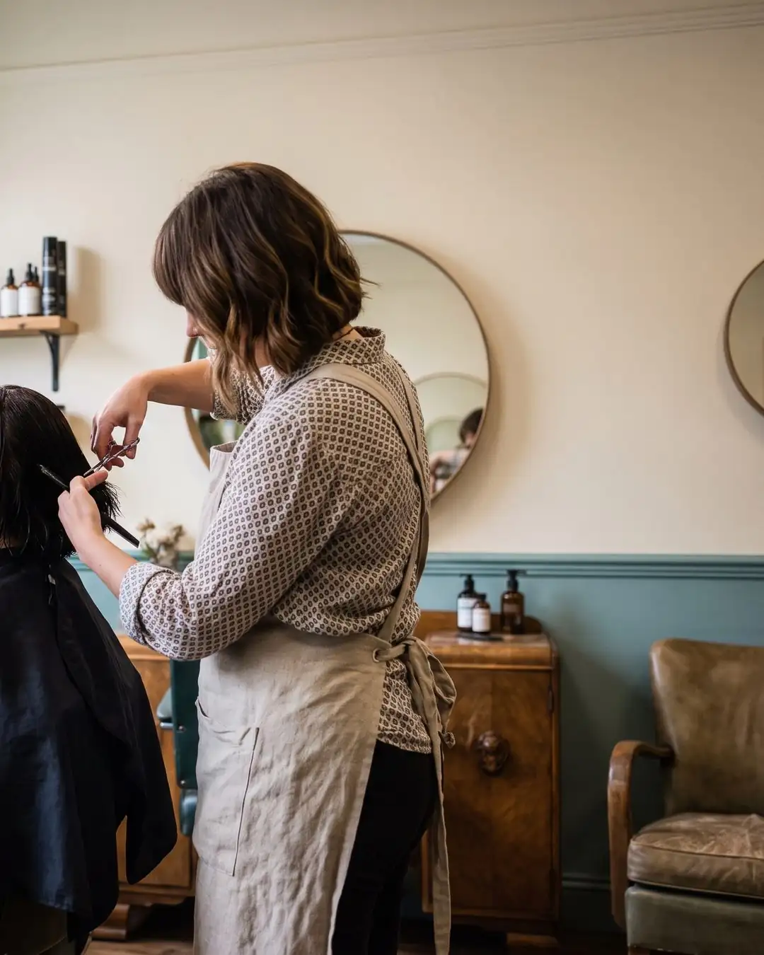 Hairdresser at work by the chair